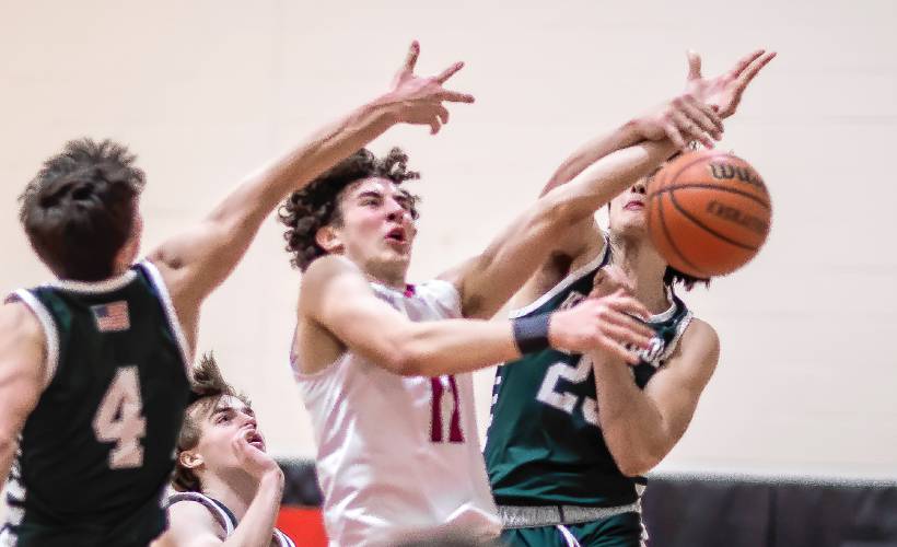 Coe-Brown forward Quinn Salter gets fouled going to the basket against Kingswood on Tuesday night, February 27, 2024 in their opening round win.