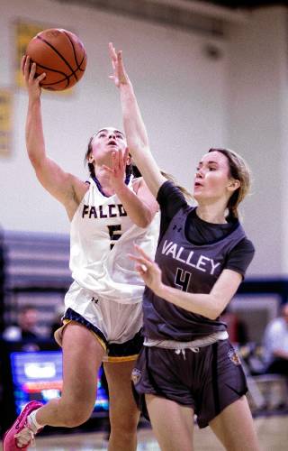 Bow guard Ella Trefethen drives against Merrimack Valley forward Annika Horne during the first half on Wednesday.