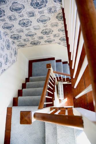 The box winder staircase that goes to all three floors.