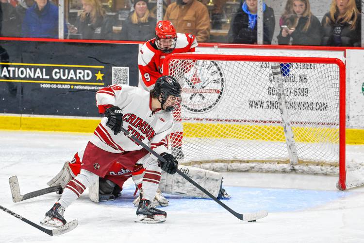 Concord junior forward Rowan Arndt prepares to backhand the puck into the back of the net during the Tide's 7-1 win over Pinkerton on Feb. 3, 2024.