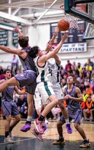 Pembroke guard Joe Fitzgerald drives to the basket in the second half of the Division II quarterfinal against Merrimack Valley on Friday night.