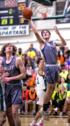 Merrimack Valley center Logan Gabour hits a runner during the first half against Merrimack Valley on Friday night.