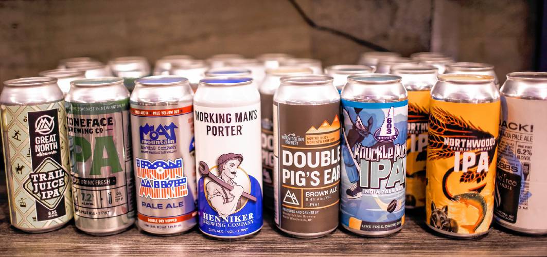 Ross Mingarelli buys beer for his speciality beer can candles at his downtown Candle Tree Soy Candle shop in Concord.