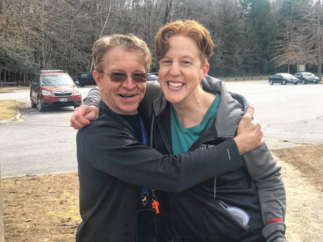 Rob Cary and Taury Anderson breathe a sigh of relief Wednesday after Anderson rescue’s Cary’s dog from the icy Merrimack River.