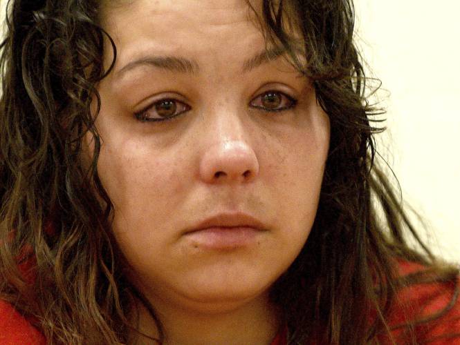 Kayla Montgomery listens to a question from the parole board at the New Hampshire Correctional Facility for Women in Concord, N.H., on Thursday, March 7, 2024. Kayla Montgomery, the estranged wife of Adam Montgomery, convicted of killing his 5-year-old daughter and moving the body around for months, has been granted parole more than a year after she was sentenced to prison for lying about where she was when the child was last seen. (David Lane/Union Leader via AP, Pool)