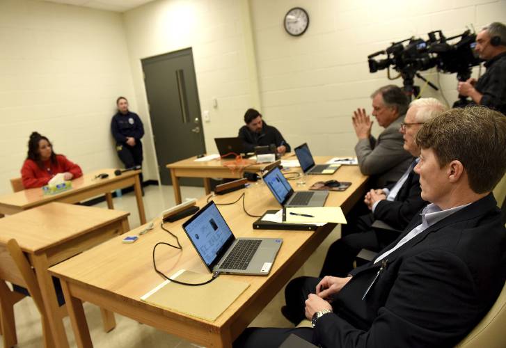 Kayla Montgomery faces the parole board member Tricia Thompson, seated from right, Roger Phillips and Horace Henriques at the New Hampshire Correctional Facility for Women in Concord, N.H., on Thursday, March 7, 2024. Kayla Montgomery, the estranged wife of Adam Montgomery, convicted of killing his 5-year-old daughter and moving the body around for months, has been granted parole more than a year after she was sentenced to prison for lying about where she was when the child was...