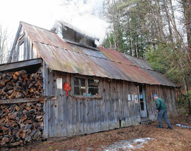 Jerry Courser outside the sugar house that he and his brother, Tim built nearly 50 years ago on Schoodac Road in Warner.