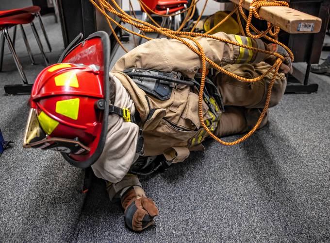 Addison “Nails” Bergeron leads the group through the obstacle course at their CRTC firefighter class at Concord High School on Thursday, March 7, 2024.