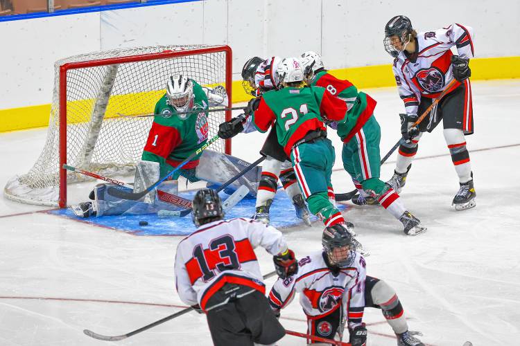 PAC goalie Liam Cripps lowers his pad for a save during the D-III boys' hockey championship at SNHU Arena on Saturday, March 9, 2024.