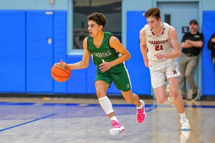 Pembroke’s Evan Berkeley dribbles the ball up the floor against Hanover in last week’s D-II semifinal encounter. Berkeley is among the Spartans’ returnees next season.