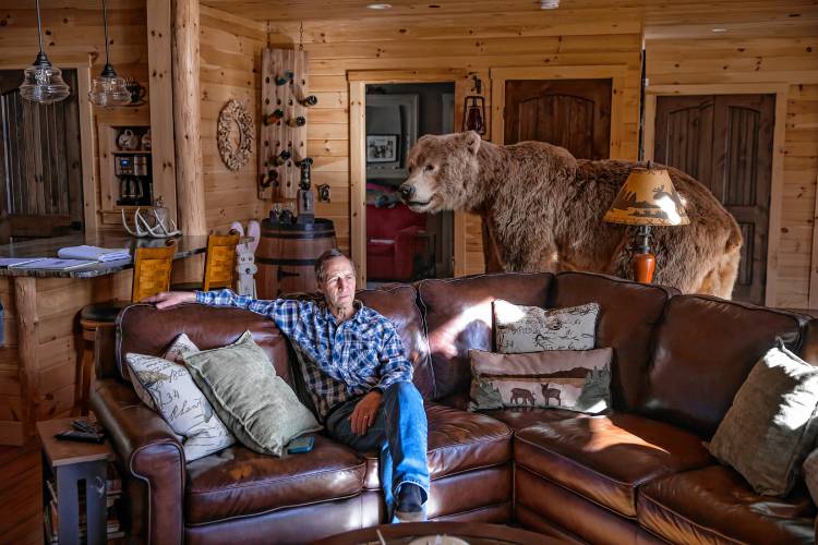 Ken Dionne sits in his living room in his New Boston home, wondering if the killer of his sister, Bobbie will be caught.