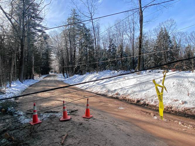 Downed power lines block Old Tilton Toad in Canterbury.