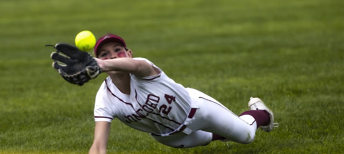 Concord left fielder Kennedy Craigue makes a diving catch for the second out of the sixth inning during the Division I softball championship last June. Craigue and the Crimson Tide held on for a 3-2 win over Winnacunnet.