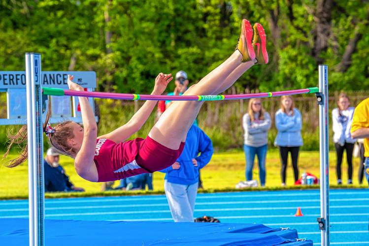 Concord High sophomore Ella Goulas clears the bar during a jump-off to claim the Division I high jump crown at the NHIAA D-I track and field championship at Salem High School last May. Goulas cleared 5 feet, 4 inches to take the title. She also finished second in the triple jump and sixth in the long jump to lead the Crimson Tide to fourth place as a team.
