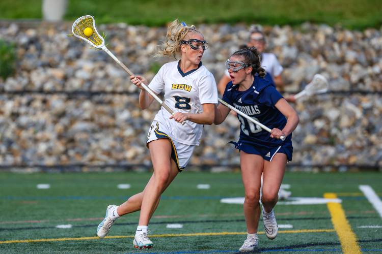 Bow’s Olivia Selleck (8) tries to get past a St. Thomas defender during last June’s D-III title game.