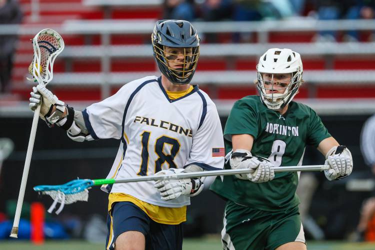 Bow’s Gavin McCabe tries to run past Hopkinton’s Steven Reddy in last season’s D-III semifinal on June 7. Bow’s season ended that day, while Hopkinton went on to win the championship. McCabe and many starters from last year’s team are back to lead the Falcons in 2024.