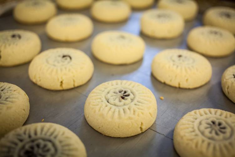 Date-filled cookies are baked fresh and then packaged at Aissa Sweets on Hall Street in Concord.